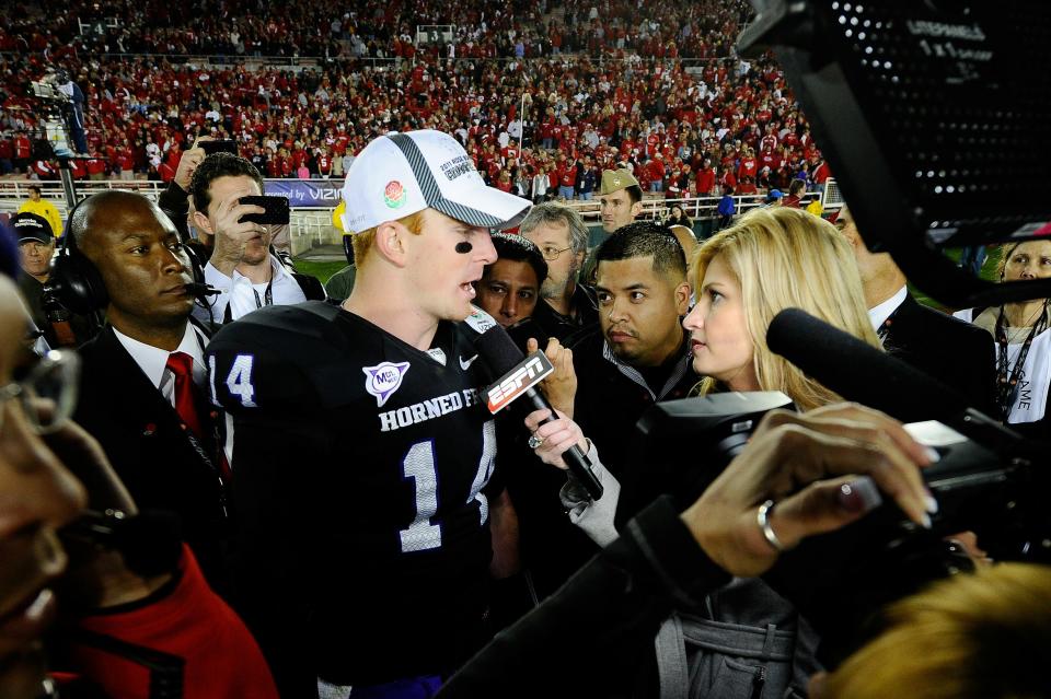 PASADENA, CA - JANUARY 01: Quarterback Andy Dalton #14 of the TCU Horned Frogs is interviewed by reporter Erin Andrews after defeating the Wisconsin Badgers 21-19 in the 97th Rose Bowl game on January 1, 2011 in Pasadena, California. (Photo by Kevork Djansezian/Getty Images)