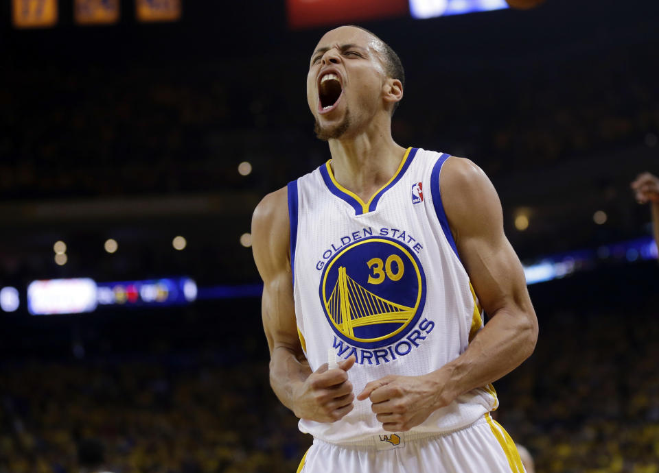 Golden State Warriors' Stephen Curry celebrates after scoring against the Los Angeles Clippers during the first half in Game 4 of an opening-round NBA basketball playoff series on Sunday, April 27, 2014, in Oakland, Calif. (AP Photo/Marcio Jose Sanchez)