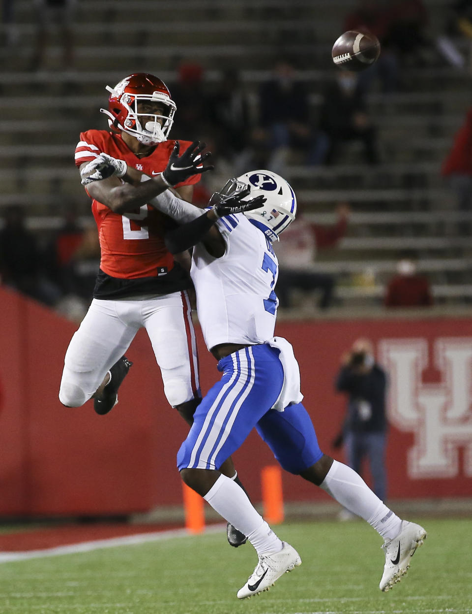 Houston safety Deontay Anderson (2) is interfered by BYU defensive back George Udo (7) during the third quarter of an NCAA college football game Friday, Oct. 16, 2020, in Houston. (Yi-Chin Lee/Houston Chronicle via AP)