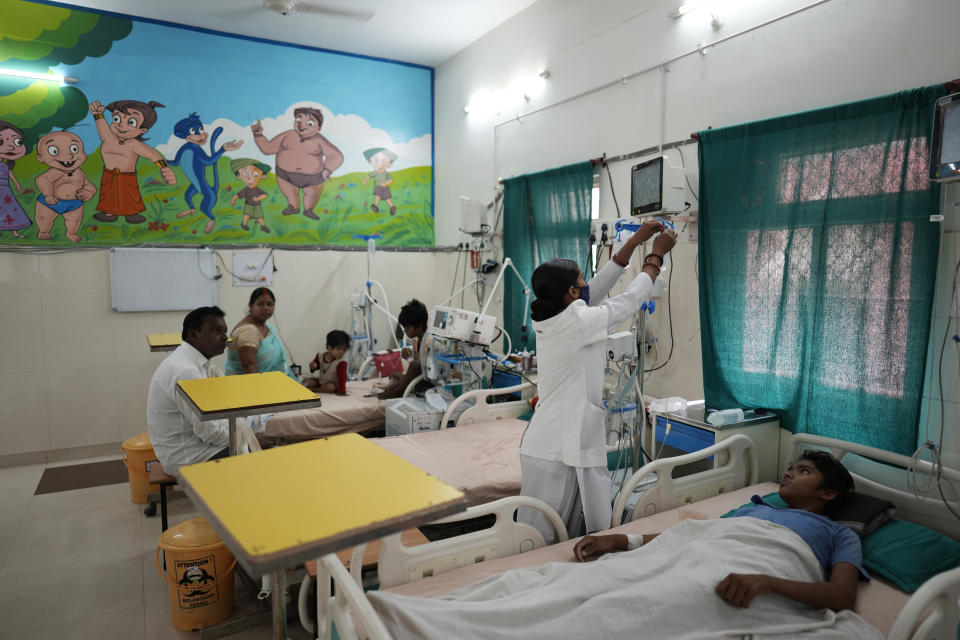 FILE - Children suffering from heat stroke ailments receive treatment at the Tej Bahadur Sapru Hospital, in Prayagraj, India, May 24, 2022. Indian authorities need more resources and better preparation to deal with searing heat particularly for the most vulnerable communities around the country, a New Delhi-based think tank said. (AP Photo/Rajesh Kumar Singh, File)