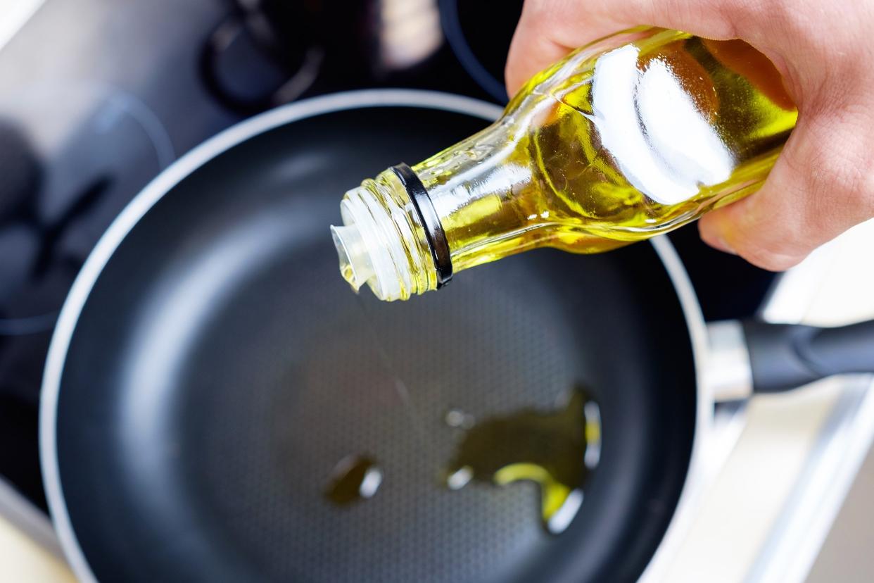olive oil dripping on skillet