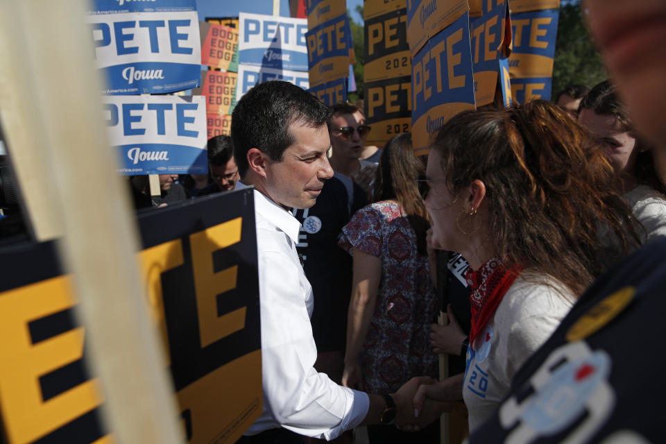 Democratic presidential candidate South Bend Mayor Pete Buttigieg, center, meets with supporters before the Iowa Democratic Wing Ding at the Surf Ballroom, Friday, Aug. 9, 2019, in Clear Lake, Iowa. (AP Photo/John Locher)