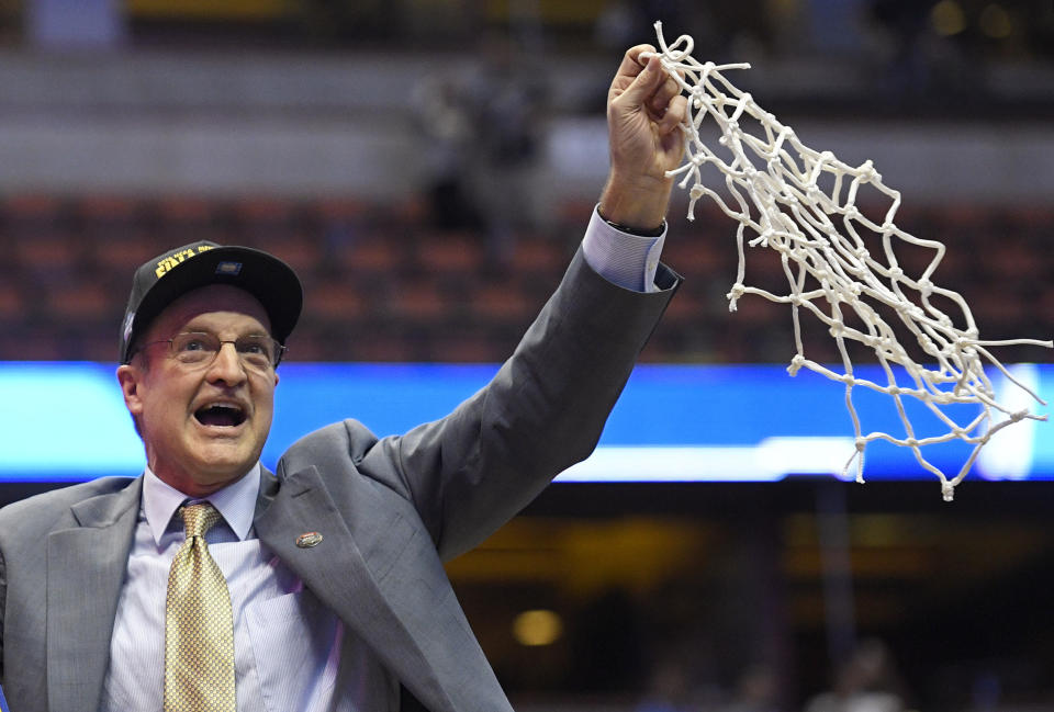 FILE - Oklahoma head coach Lon Kruger cuts down the net after their win against Oregon during an NCAA college basketball game in the regional finals of the NCAA Tournament, Saturday, March 26, 2016, in Anaheim, Calif. Roy Williams and Jim Calhoun will join John Beilein and Lon Kruger in a star-studded cast of coaches who will be inducted into the National College Basketball Hall of Fame in November. (AP Photo/Mark J. Terrill, File)