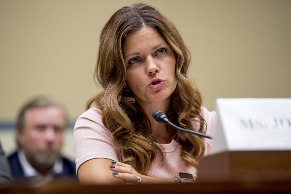 Ruby Johnson, who's daughter was recently hospitalized with a respiratory illness from vaping, testifies before a House Oversight subcommittee hearing on lung disease and e-cigarettes on Capitol Hill in Washington, Tuesday, Sept. 24, 2019. (AP Photo/Andrew Harnik)