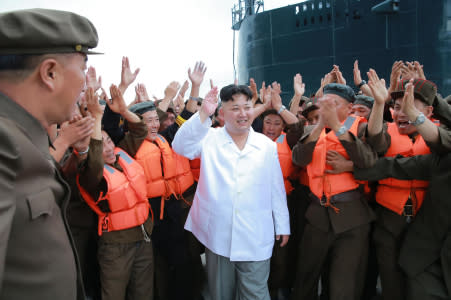 This undated picture released from North Korea's official Korean Central News Agency (KCNA) on August 25, 2016 shows North Korean leader Kim Jong-Un (C) waving as he inspects a test-fire of strategic submarine-launched ballistic missile at an undisclosed location. / AFP / KCNA / KNS / South Korea OUT / REPUBLIC OF KOREA OUT / SOUTH KOREA OUT ---EDITORS NOTE--- RESTRICTED TO EDITORIAL USE - MANDATORY CREDIT "AFP PHOTO/KCNA VIA KNS" - NO MARKETING NO ADVERTISING CAMPAIGNS - DISTRIBUTED AS A SERVICE TO CLIENTS THIS PICTURE WAS MADE AVAILABLE BY A THIRD PARTY. AFP CAN NOT INDEPENDENTLY VERIFY THE AUTHENTICITY, LOCATION, DATE AND CONTENT OF THIS IMAGE. THIS PHOTO IS DISTRIBUTED EXACTLY AS RECEIVED BY AFP. / (Photo credit should read KNS/AFP/Getty Images)