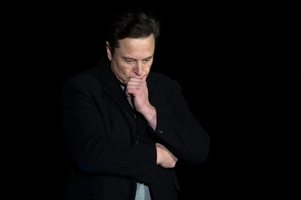 Elon Musk pauses and looks down as he speaks during a press conference at SpaceX's Starbase facility near Boca Chica Village in South Texas on February 10, 2022 (AFP via Getty Images)