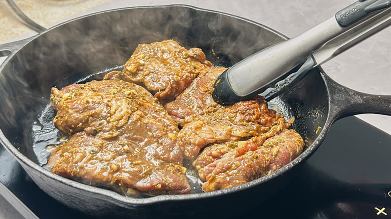 searing steak in skillet