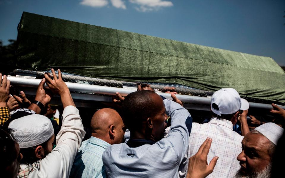 Pallbearers carry the coffin of Anti-apartheid stalwart Ahmed Kathrada during the funeral of Kathrada - Credit: AFP