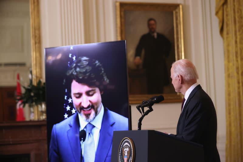 U.S. President Joe Biden and Canada’s Prime Minister Justin Trudeau, appearing via video conference call, give closing remarks at the end of their virtual bilateral meeting from the White House in Washington