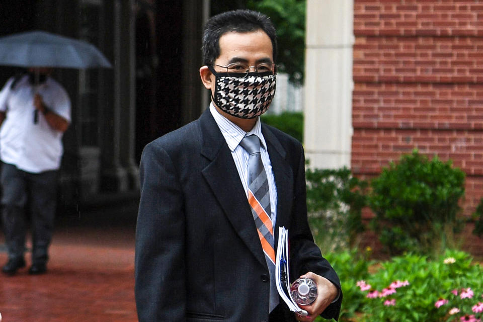 Anming Hu enters the Howard H. Baker Jr. United States Courthouse in downtown Knoxville, Tenn., on June 7, 2021. (Caitie McMekin / News Sentinel/USA TODAY Network)