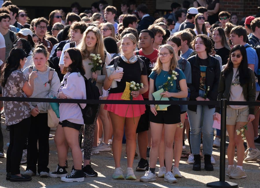 University of Georgia students gather to pay tribute to Laken Riley at the Tate Plaza on campus in Athens, Ga., Monday, Feb. 26, 2024. Riley, a nursing student at Augusta University’s Athens campus, was found dead Thursday, Feb. 22, after a roommate reported she didn’t return from a morning run in a wooded area of the UGA campus near its intramural fields. Students also gathered to pay tribute to a UGA student who committed suicide last week. (Nell Carroll/Atlanta Journal-Constitution via AP)