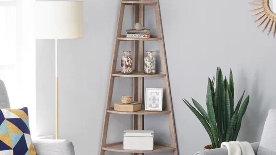 Wayfair has plenty of bookcase deals, like this Tisha corner piece, to make any room at home stand out.