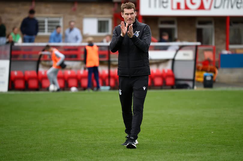 Matt Taylor applauds the travelling Bristol Rovers supporters at Cheltenham Town -Credit:Wil Cooper/EFL