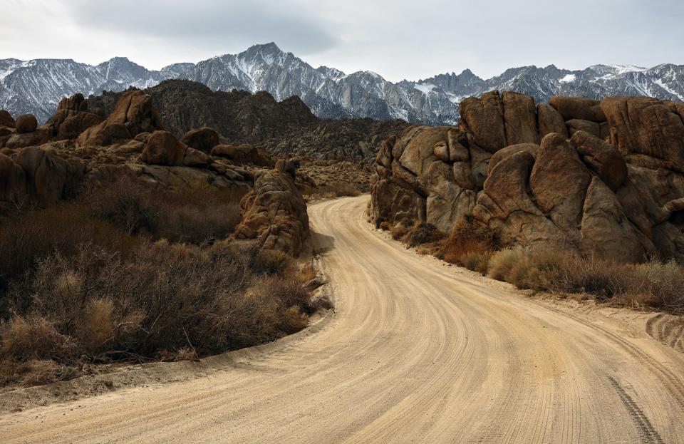 The lightly snow-capped Sierra Nevada Mountains rise above the Alabama Hills on February 20, 2022 near Lone Pine, California.