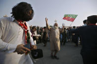 Supporters of ousted Pakistani Prime Minister Imran Khan dance during in an anti government rally, in Islamabad, Pakistan, Thursday, May 26, 2022. Defiant former Prime Minister Khan early Thursday warned Pakistan's government to set new elections in the next six days or he will again march on the capital along with 3 million people. (AP Photo/Anjum Naveed)