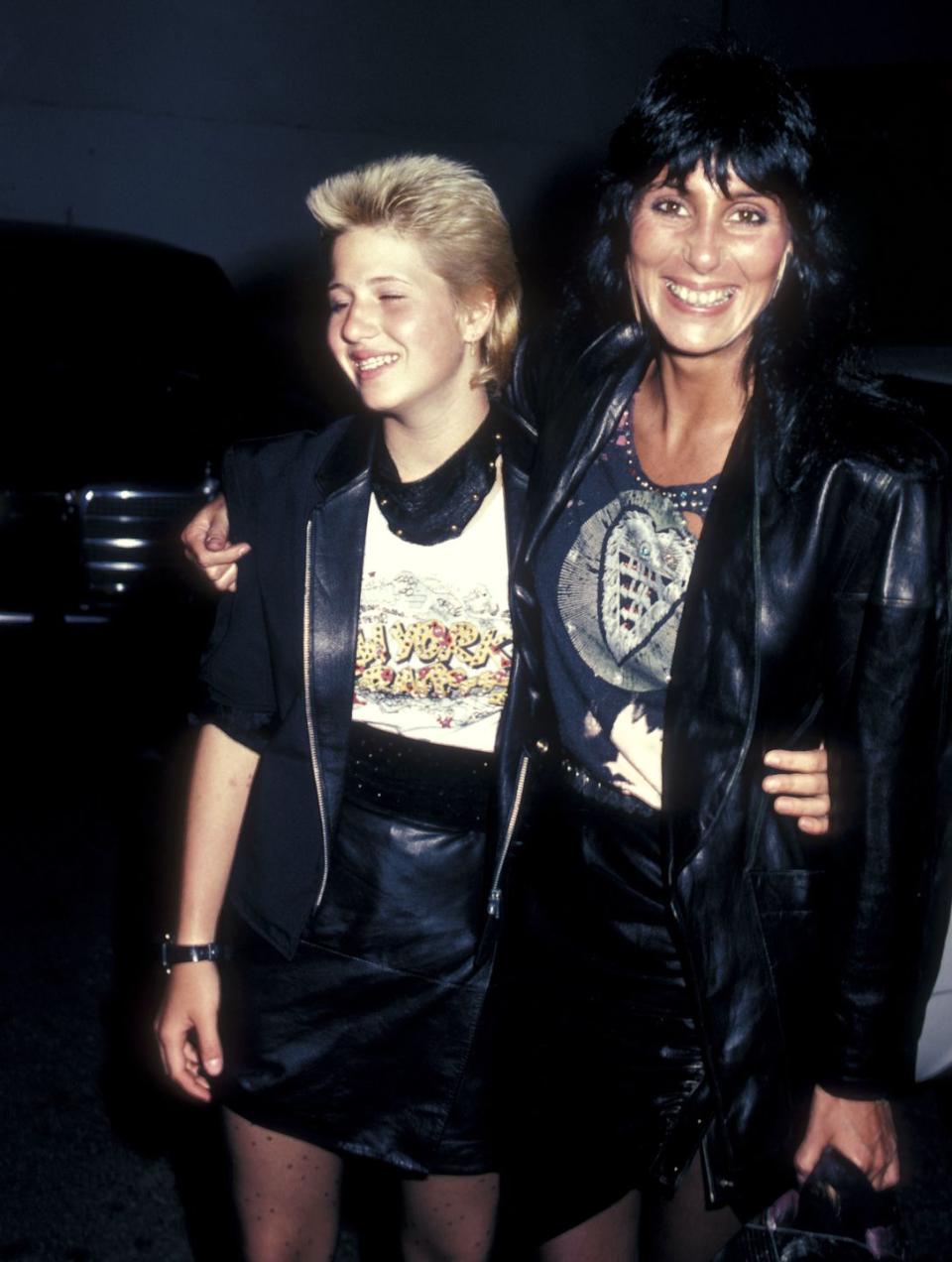 <p>Cher and Chaz Bono wear leather jackets and skirts while dining in West Hollywood, California. </p>