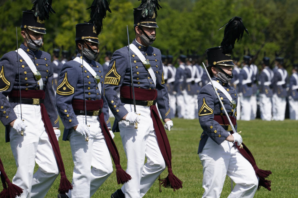 Corps of Cadet Commander Kasey Meredith, of Johnstown, Pa., right, leads the corps during a change of command parade and ceremony on the parade grounds at the school in Lexington, Va., Friday, May 14, 2021. Meredith will be the first female to lead the Virginia Military Institute's Corps of Cadets in its 182 year history. (AP Photo/Steve Helber)