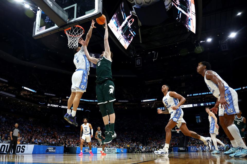 CHARLOTTE, NORTH CAROLINA - MARCH 23: Jaxon Kohler #0 of the Michigan State Spartans shoots the ball against Seth Trimble #7 of the North Carolina Tar Heels during the second half in the second round of the NCAA Men's Basketball Tournament at Spectrum Center on March 23, 2024 in Charlotte, North Carolina. (Photo by Jared C. Tilton/Getty Images)