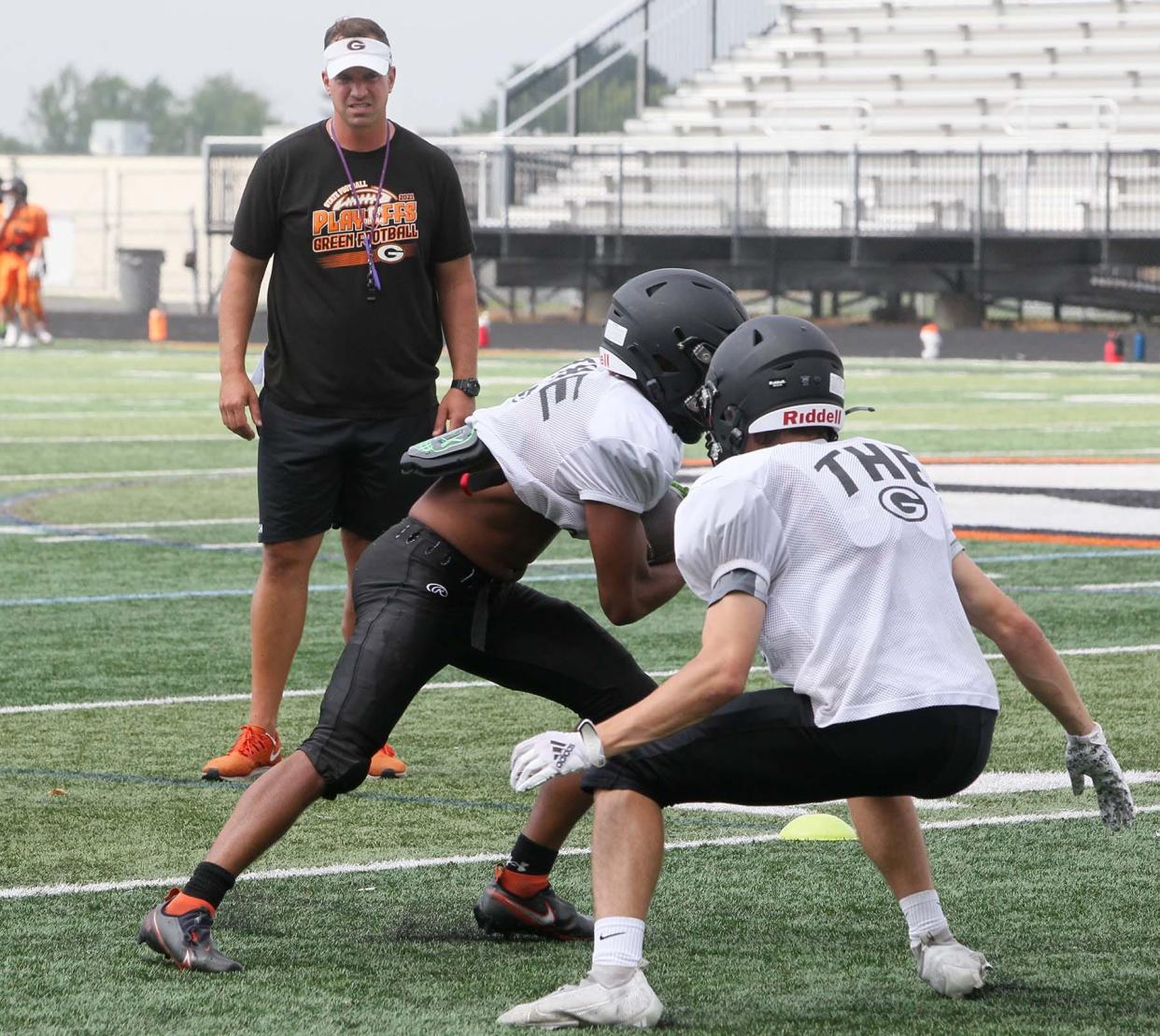 Green football coach Mark Geis led the Bulldogs to the Division II state semifinals in 2021 and will be looking to reload for another run in 2022. [Karen Schiely/Beacon Journal]