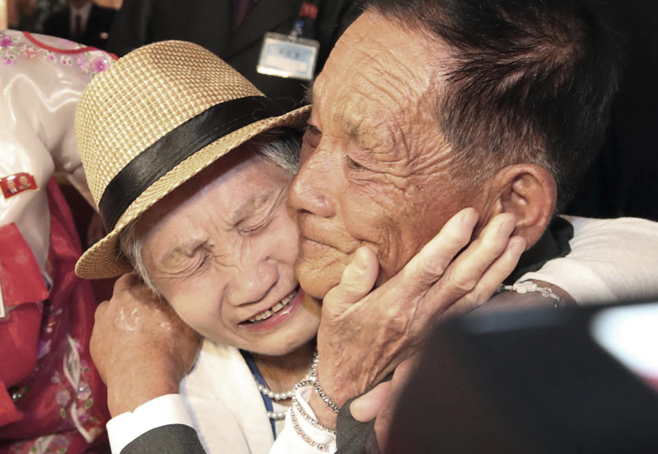 South Korean Lee Keum-seom, 92, left, weeps with her North Korean son Ri Sang Chol, 71, during the Separated Family Reunion Meeting at the Diamond Mountain resort in North Korea, Monday, Aug. 20, 2018. Dozens of elderly South Koreans crossed the heavily fortified border into North Korea on Monday for heart-wrenching meetings with relatives most haven't seen since they were separated by the turmoil of the Korean War. (Lee Ji-eun/Yonhap via AP)