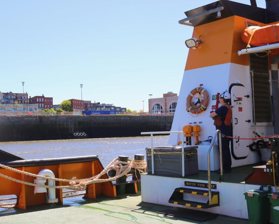 Deckhand Alex Black surveys the view of the south end of Saint John and the Marco Polo Cruise Ship terminal - a vantage point few locals get to experience every day. 