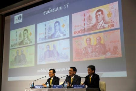 Central bank governor Veerathai Santiprabhob unveils new baht bank notes featuring Thailand's King Maha Vajiralongkorn during a news conference at Bank of Thailand headquarters in Bangkok, Thailand March 8, 2018. REUTERS/Jorge Silva