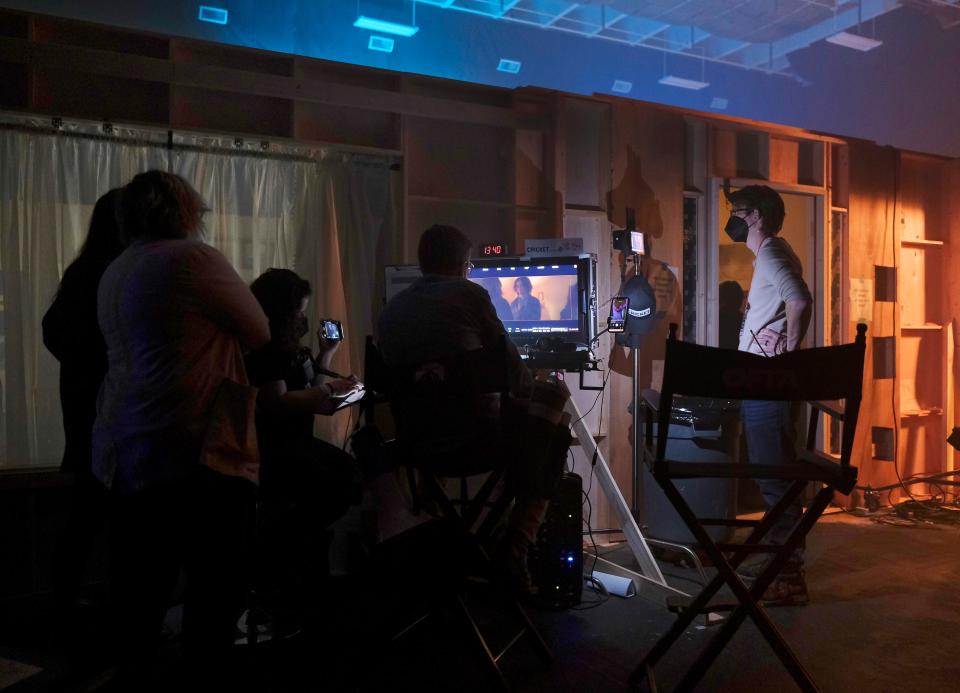 Director Richard Janes watches the monitor March 9 as a scene is shot on his musical drama "Cricket" at Green Pastures Studio in Spencer.