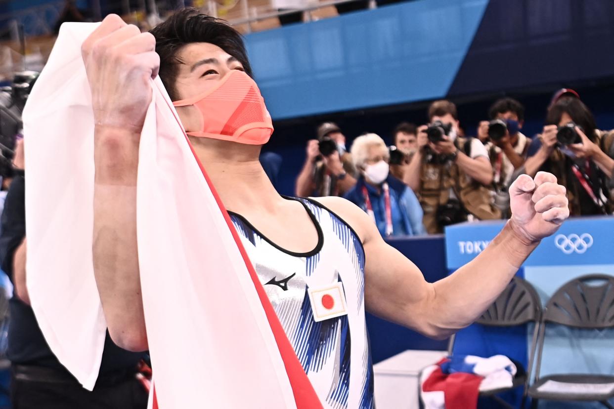 Daiki Hashimoto celebrates winning the men’s all-around final (Getty)