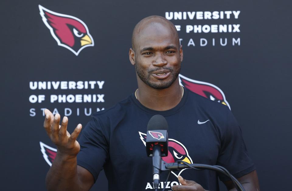 New Arizona Cardinals running back Adrian Peterson answers a question during a news conference after practice at the team training facility on Wednesday. (AP)