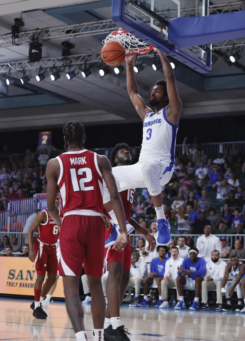 In a photo provided by Bahamas Visual Services, Memphis' Jordan Brown dunks against Arkansas during the second half of an NCAA college basketball game in the Battle 4 Atlantis at Paradise Island, Bahamas, Thursday, Nov. 23, 2023. (Tim Aylen/Bahamas Visual Services via AP)