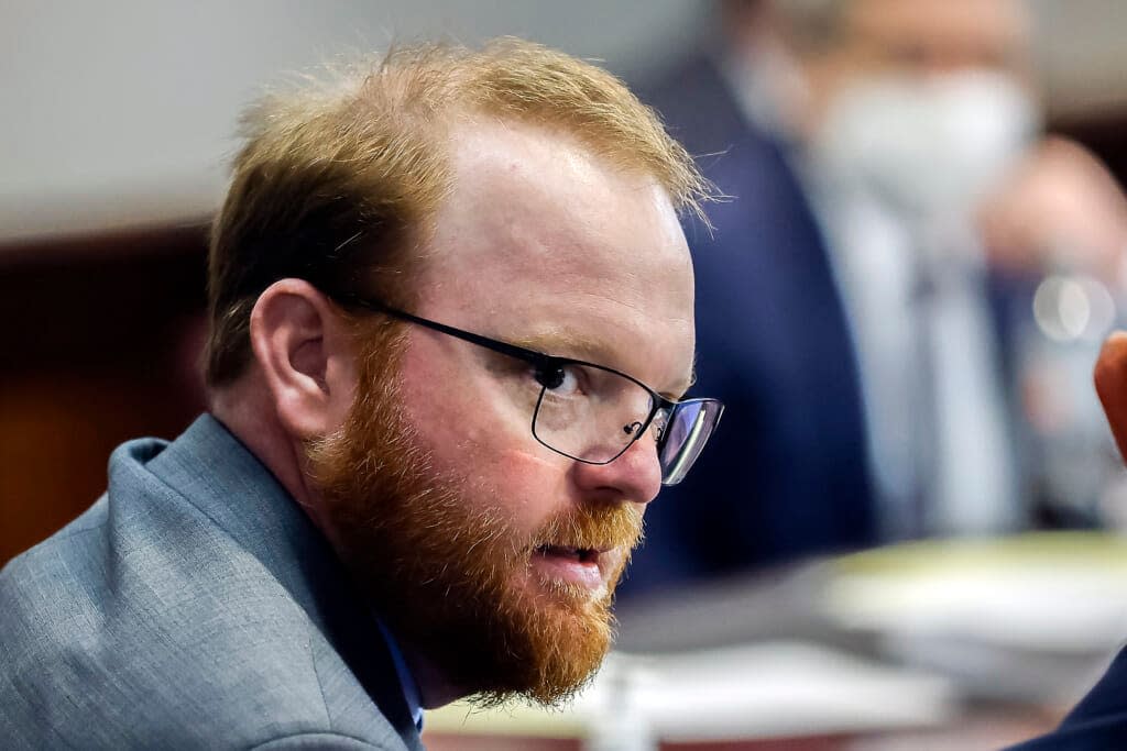 Travis McMichael looks on during the sentencing in his trial along with his father Greg McMichael and neighbor, William “Roddie” Bryan in the Glynn County Courthouse, on Jan. 7, 2022, in Brunswick, Ga. (AP Photo/Stephen B. Morton, Pool, File)