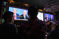 Patrons watch President Joe Biden debate Republican presidential candidate and former President Donald Trump, at a debate watch party Thursday, June 27, 2024, in Scottsdale, Ariz. (AP Photo/Ross D. Franklin)