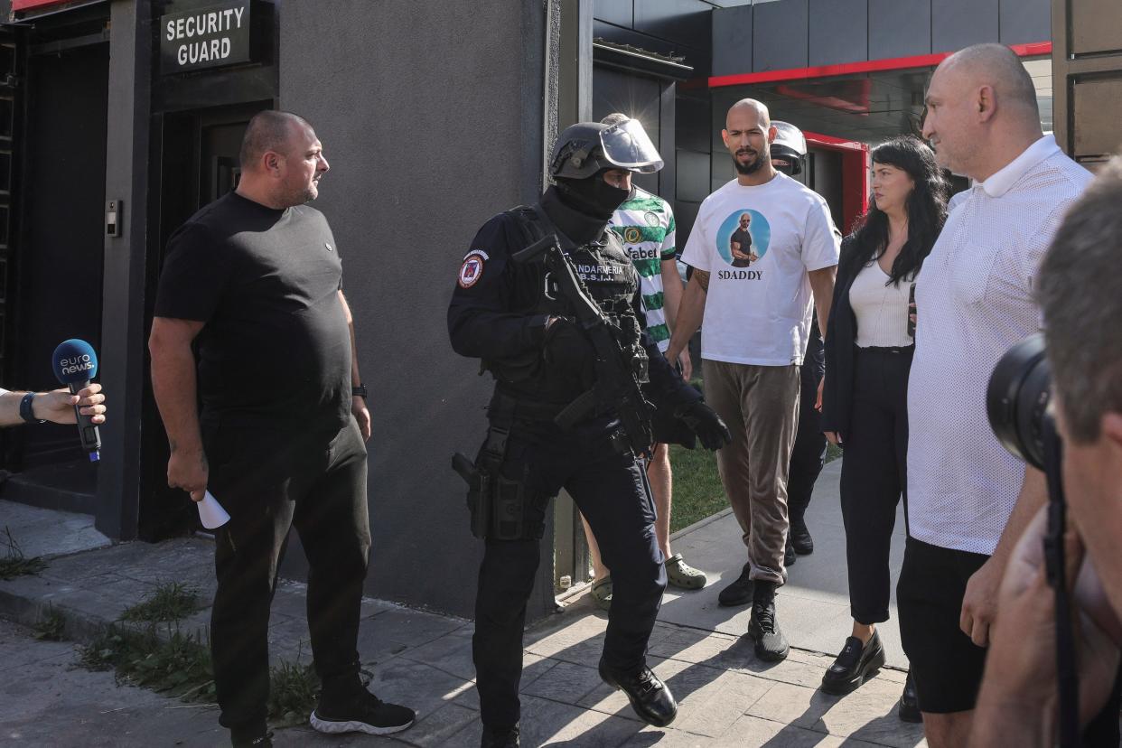 Romanian Gendarmes from the Special Intervention Brigade escort Andrew Tate outside the Tate brothers residence in Pipera, Ilfov, near Bucharest, Romania, August 21, 2024.