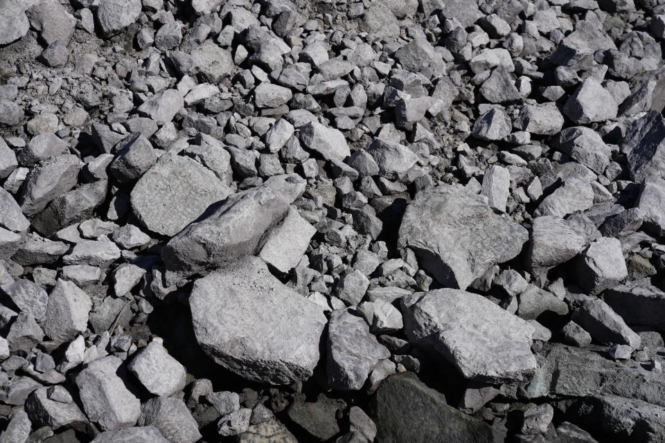 A uranium ore rock pile is the first to be mined at the Energy Fuels Inc. uranium Pinyon Plain Mine Wednesday, Jan. 31, 2024, near Tusayan, Ariz. The largest uranium producer in the United States is ramping up work just south of Grand Canyon National Park on a long-contested project that largely has sat dormant since the 1980s. (AP Photo/Ross D. Franklin)