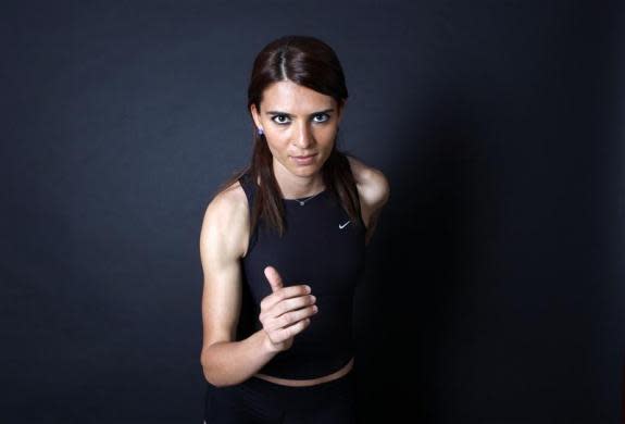 Turkish 800-meter runner and Olympic hopeful Merve Aydin, 22, poses for a picture in Ankara May 23, 2012. Aydin will run at the Olympics for the first time this year. Her daily intake is 3000 kcal. Although she is rigorously training for the Games, she remains guarded on the outcome. "It is more important for me to realize my true potential and limitations. And do the best I can. I work hard and keep a careful diet," she says.