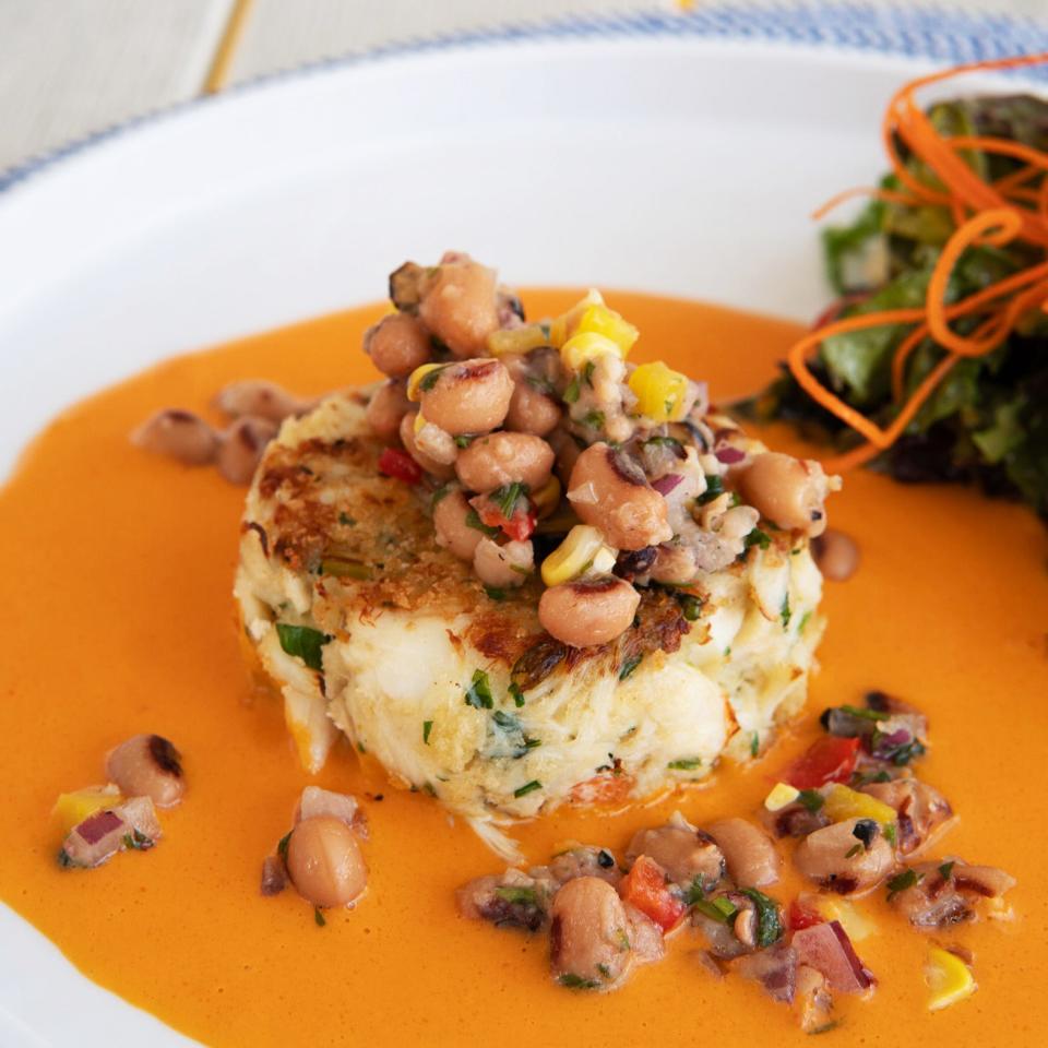 The crab cake at Breeze Ocean Kitchen comes with a Cajun-inspired accompaniment.