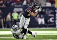 <p>Houston Texans tight end Ryan Griffin (84) is tacked by Oakland Raiders strong safety Karl Joseph (42) during the first quarter of the AFC Wild Card playoff football game at NRG Stadium. Mandatory Credit: Jerome Miron-USA TODAY Sports </p>