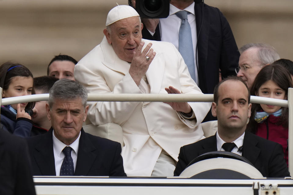 Pope Francis waves faithful at the end of his weekly general audience in St. Peter's Square, at the Vatican, Wednesday, April 3, 2024. (AP Photo/Alessandra Tarantino)