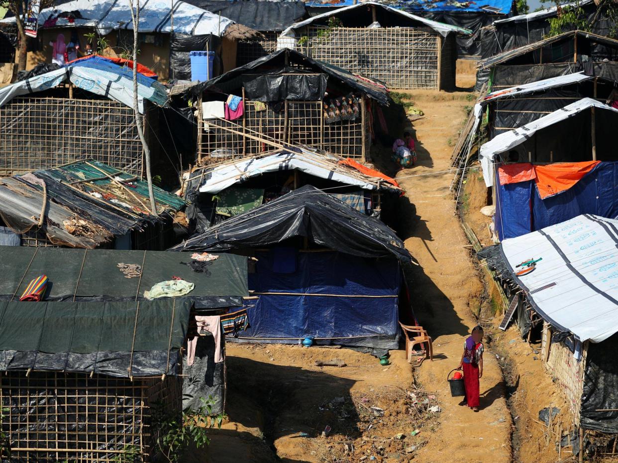 In Kutupalong Camp, Bangladesh, two whole families live together under a single piece of tarpaulin: Reuters