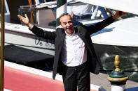 <p>Roberto Benigni looked thrilled to be back at the Venice Film Festival. The Italian actor smiled big and threw his arms open as he arrived on Sept. 1.</p>