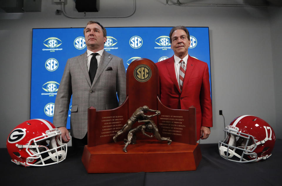 Georgia coach Kirby Smart (L) and Alabama coach Nick Saban pose near the SEC trophy on Nov. 30, 2018. (AP)