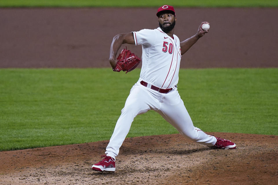 Cincinnati Reds relief pitcher Amir Garrett throws during the ninth inning of the team's baseball game against the Pittsburgh Pirates in Cincinnati, Tuesday, Sept. 15, 2020. (AP Photo/Bryan Woolston)