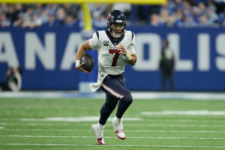 Houston Texans quarterback C.J. Stroud (7) runs during the second half of an NFL football game against the Indianapolis Colts, Saturday, Jan. 6, 2024, in Indianapolis. (AP Photo/Michael Conroy)