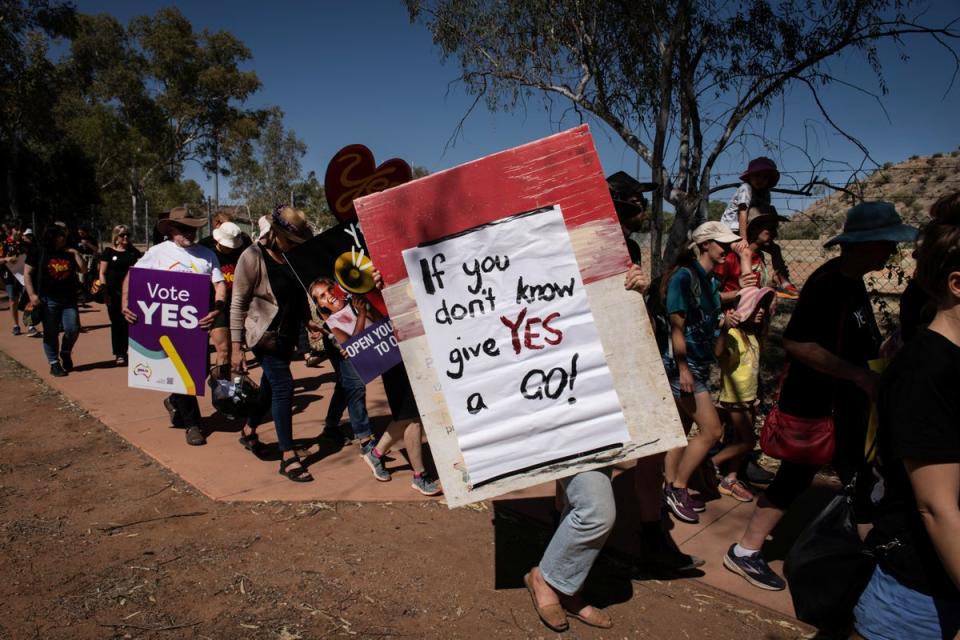 People rally during the Walk for Yes, hosted by the Yes23 campaign, at the Todd River in Alice Springs (Reuters)