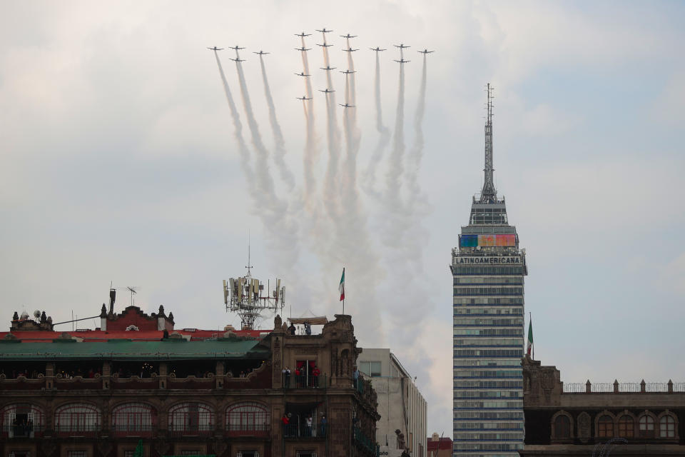 VARIOUS CITIES, MEXICO - SEPTEMBER 16: Mexican Air Force aircrafts perform a ceremonial flight during the Independence Day military parade at Zocalo Square on September 16, 2020 in Various Cities, Mexico. This year El Zocalo remains closed for general public due to coronavirus restrictions. Every September 16 Mexico celebrates the beginning of the revolution uprising of 1810. (Photo by Hector Vivas/Getty Images)