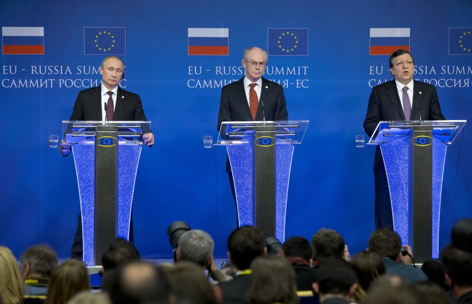 Russian President Vladimir Putin, left, European Council President Herman Van Rompuy, center, and European Commission President Jose Manuel Barroso attend a news conference at the European Commission headquarters in Brussels, Belgium, Tuesday, Jan. 28, 2014. Russian President Vladimir Putin on Tuesday insisted Moscow would come through on its economic commitments towards Ukraine even if the country’s leadership were to change. At their shortened 3-hour EU-Russia summit, both sides acknowledged that wide-ranging differences over Ukraine’s choice whether to align itself closely with the EU remained, but stressed economic interests forced them to look for a common future. (AP Photo/Alexander Zemlianichenko)