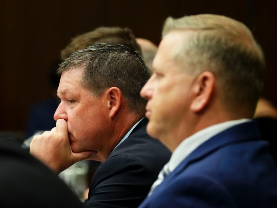 Witnesses Scott Smith, Hockey Canada's president and chief operating officer, left, and Hockey Canada chief financial officer Brian Cairo appear at the standing committee on Canadian Heritage in Ottawa on July 27. The committee is looking into how Hockey Canada handled allegations of sexual assault and a subsequent lawsuit. (Sean Kilpatrick/The Canadian Press - image credit)