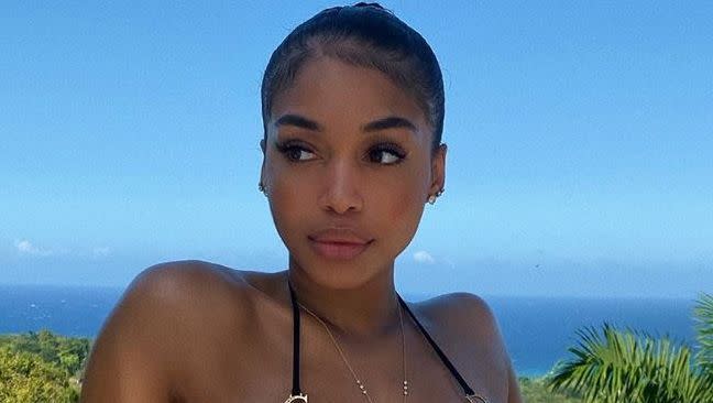 Lori Harvey poses in swimwear