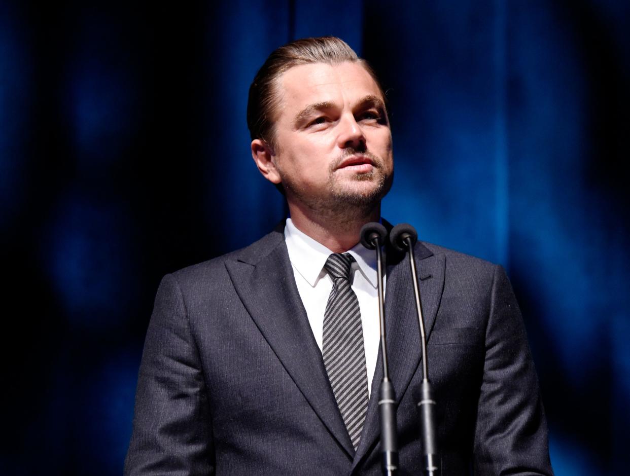 Leonardo DiCaprio looks gorgeous in this fine grey suit with striped tie to match