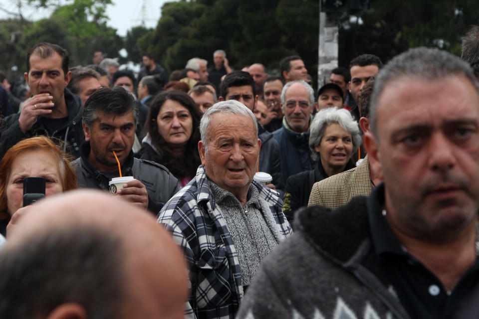 Greek farmers market vendor gather during a protest near The White Tower in the northern Greek city of Thessaloniki, Tuesday, May 6, 2014. The vendors, who closed their street markets indefinitely for the last nine days are the latest professional group to protest a government overhaul of market rules aimed at boosting competition in the bailed-out country. Weekly farmers' markets are very popular in Greece and are found in most city neighborhoods. (AP Photo/Nikolas Giakoumidis)